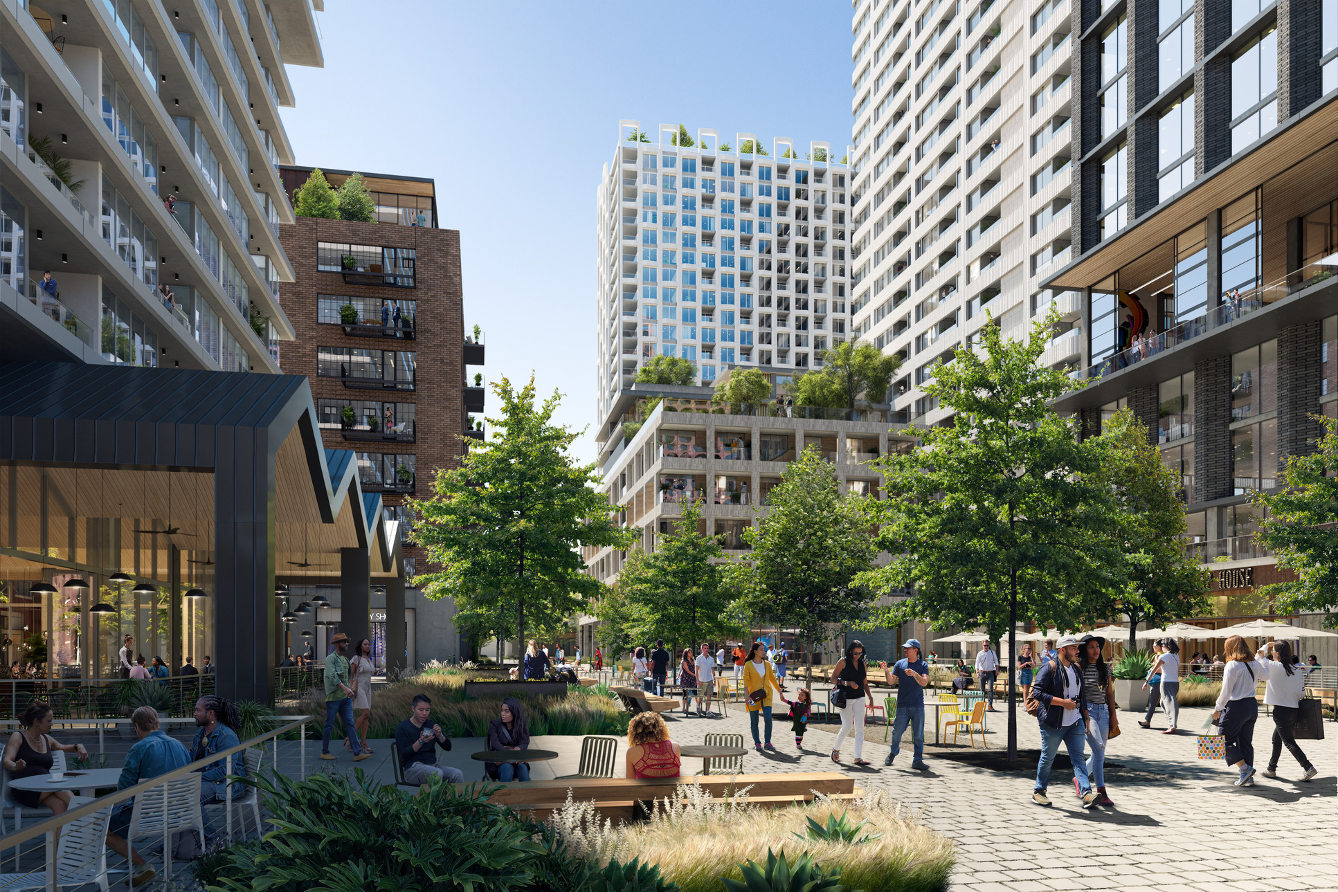 Urban park with people enjoying greenery amid tall modern buildings.